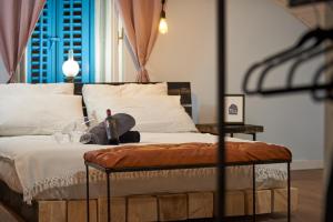 Postel nebo postele na pokoji v ubytování Bubalus Boutique Rooms