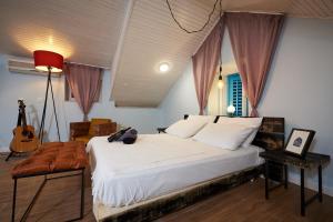 Postel nebo postele na pokoji v ubytování Bubalus Boutique Rooms