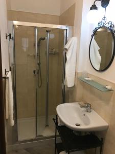 a bathroom with a shower and a sink and a mirror at Casale Degli Angeli in Vieste +53 photos