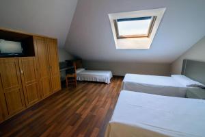 Postel nebo postele na pokoji v ubytování Hostal El Palacio