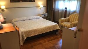 Postel nebo postele na pokoji v ubytování Hotel Ai Tufi