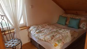 Postel nebo postele na pokoji v ubytování Fort Janowek