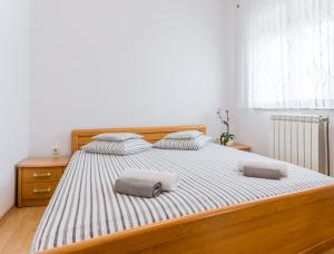 Łóżko lub łóżka w pokoju w obiekcie Apartments Contessa