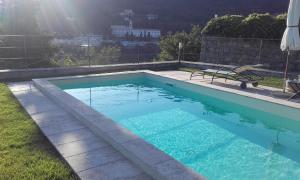 The swimming pool at or close to il corbezzolo - Suite