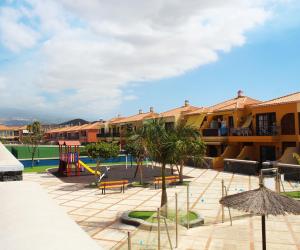 a resort with a playground at Holiday House Atlantico in Costa Del Silencio