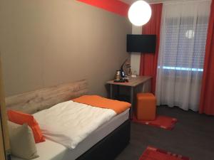 Postel nebo postele na pokoji v ubytování Hotel am Brünnchen