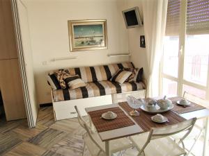 a living room with a table and a couch at Casa Privata FOR YOU in Minori