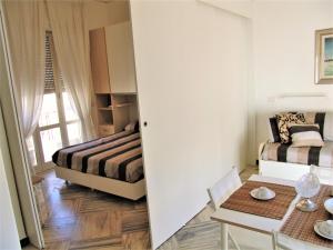 a bedroom with a bed and a table in a room at Casa Privata FOR YOU in Minori