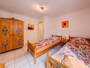 Ein Bett oder Betten in einem Zimmer der Unterkunft Gästehaus Eschbach