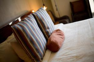 Postel nebo postele na pokoji v ubytování Hotel Helverica