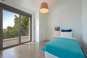 Posteľ alebo postele v izbe v ubytovaní Villa Olympos