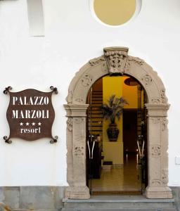 an archway entrance to a building with a sign at Palazzo Marzoli charme Resort - Small Luxury Hotel in Positano