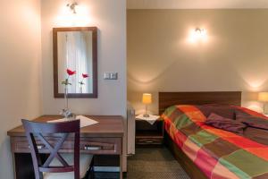 Łóżko lub łóżka w pokoju w obiekcie Janówka Apartamenty