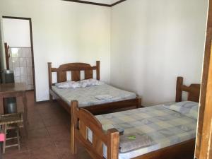 מיטה או מיטות בחדר ב-Tiquisia Lodge