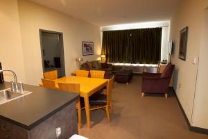 a kitchen and living room with a table and chairs at Expedition Station in Snowshoe