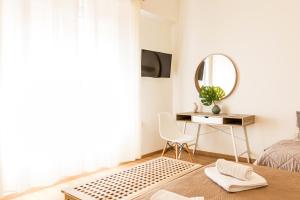 Televízia a/alebo spoločenská miestnosť v ubytovaní Aloe Apartments