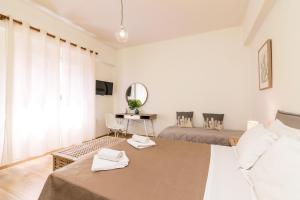 Posteľ alebo postele v izbe v ubytovaní Aloe Apartments