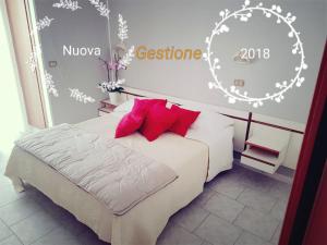 Postel nebo postele na pokoji v ubytování Hotel Giannella