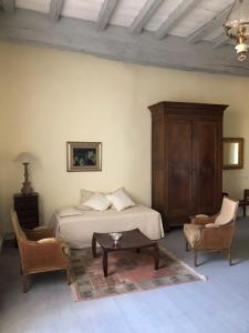 Ein Bett oder Betten in einem Zimmer der Unterkunft L'Ancien Couvent Cahuzac