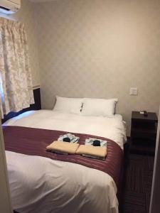 Postel nebo postele na pokoji v ubytování Hotel Sunmarine