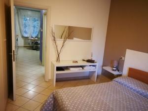Postel nebo postele na pokoji v ubytování B&B Covidafranciacorta + 3 fotografie