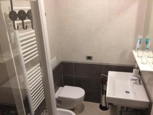 a bathroom with a toilet and a sink at Affittacamere AlFrantoio in Monterosso al Mare +10 photos