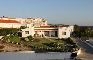 a view of a house with a yard at Vila Private Pool Beach Golf Praia Del Rey in Amoreira