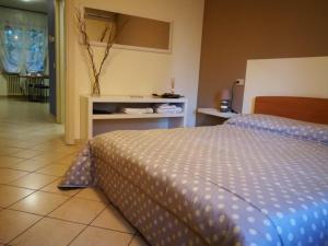 Postel nebo postele na pokoji v ubytování B&B Covidafranciacorta