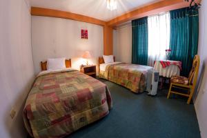 Postel nebo postele na pokoji v ubytování Hotel T'ika + 21 fotografií