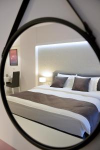 Łóżko lub łóżka w pokoju w obiekcie JessApart – Ochota Apartments