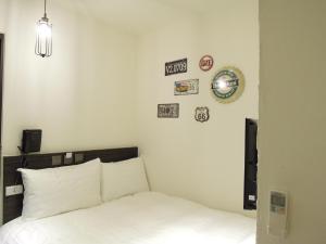 Postel nebo postele na pokoji v ubytování Re-Change Hotel Taipei