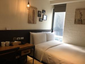 Postel nebo postele na pokoji v ubytování Re-Change Hotel Taipei