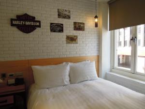 Postel nebo postele na pokoji v ubytování Re-Change Hotel Taipei