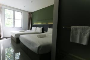 Postel nebo postele na pokoji v ubytování Hotel 99 Kota Kemuning