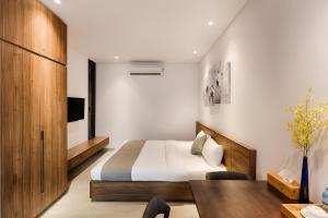 Giường trong phòng chung tại Fanta Suite Villa