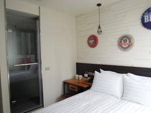 Postel nebo postele na pokoji v ubytování Re-Change Hotel Taipei