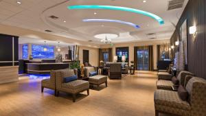 a lobby with couches and chairs and a waiting room at Best Western Plus Hollywood/Aventura in Hollywood