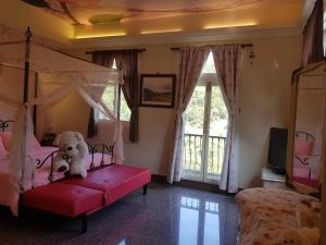 Postel nebo postele na pokoji v ubytování Shuanghu Garden B&B