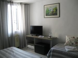TV a/nebo společenská místnost v ubytování Venice Home