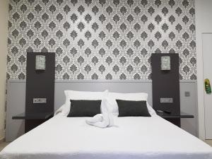 Postel nebo postele na pokoji v ubytování Hospedium Hotel Veracruz + 51 fotografií