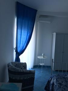 Postel nebo postele na pokoji v ubytování B&B Mammaliturchi SCALA DEI TURCHI