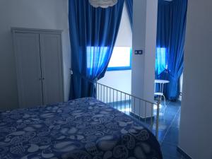 Postel nebo postele na pokoji v ubytování B&B Mammaliturchi SCALA DEI TURCHI