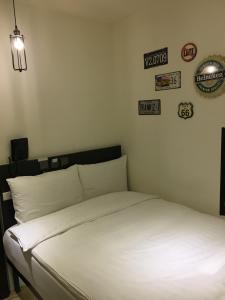 Postel nebo postele na pokoji v ubytování Re-Change Hotel Taipei