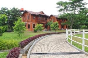 a brick walkway in front of a building at APM Equestrian Resort in Tangerang