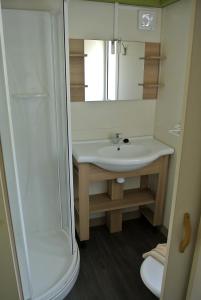 a bathroom with a sink and a shower at Camping Fossa Lupara in Sestri Levante