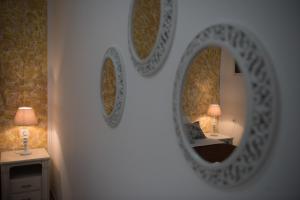 
a room with a mirror and a lamp at Dora Apartments in Agia Pelagia
