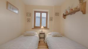 A bed or beds in a room at Saplan Real Estate PLETA NHEU