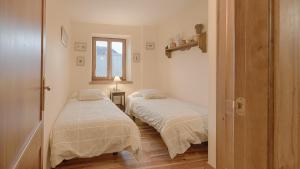 A bed or beds in a room at Saplan Real Estate PLETA NHEU