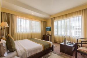 Katil atau katil-katil dalam bilik di Mount Kailash Resort