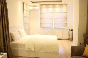 Postel nebo postele na pokoji v ubytování Super Luxury Apartments